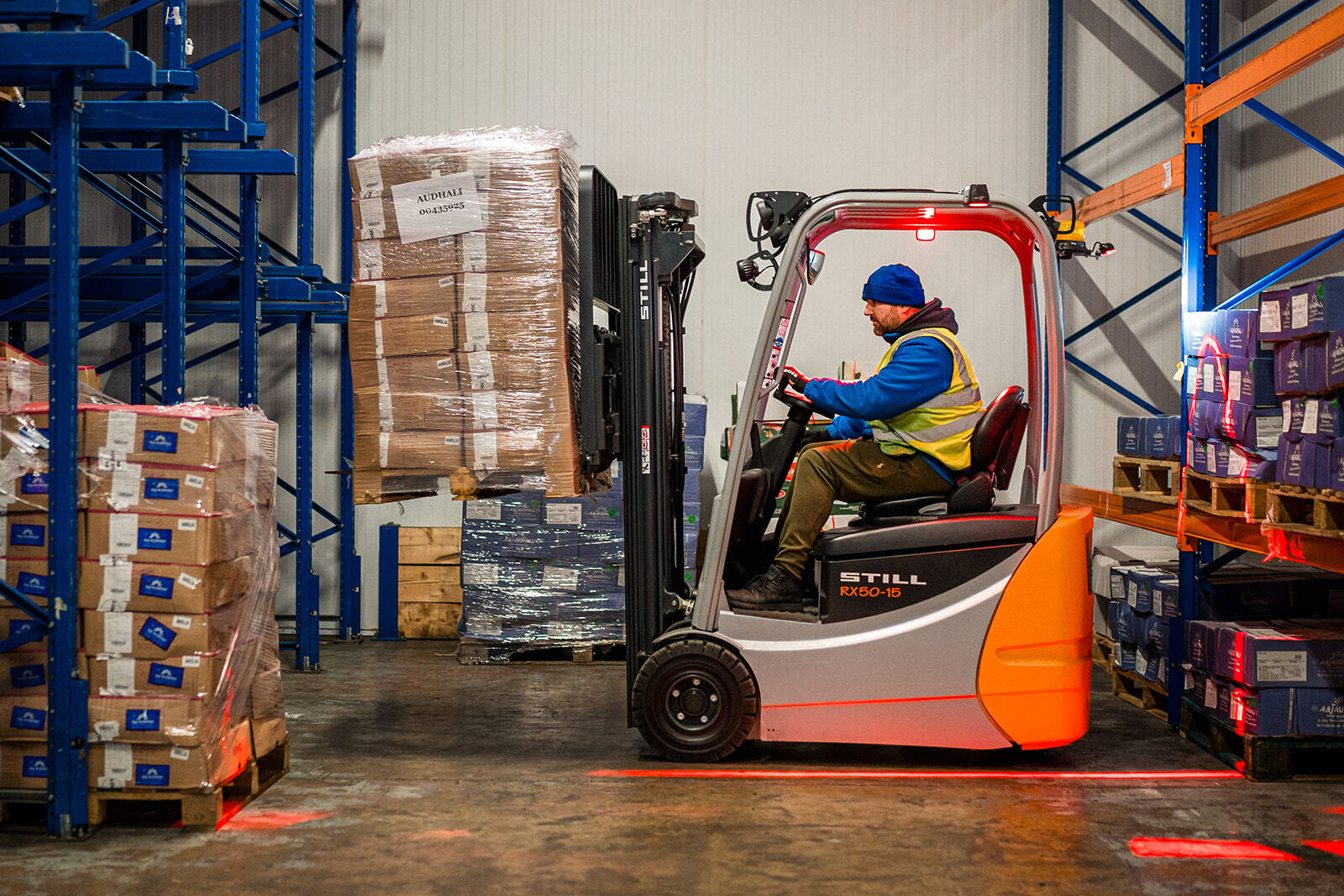 Forklift driving in warehouse